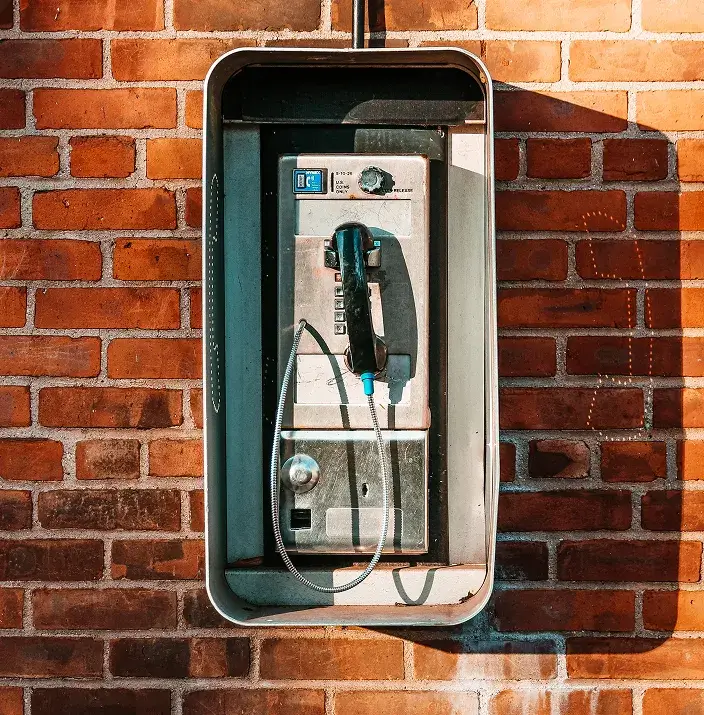 Vintage payphone mounted on the wall
