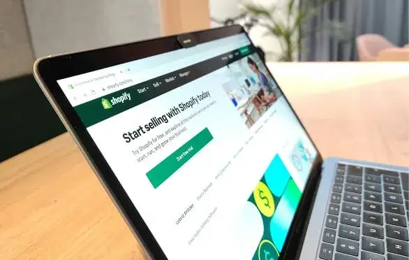 Shopify store setup displayed on laptop